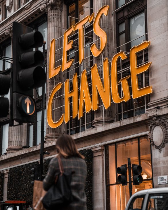 Photo of sign saying "Let's Change"
