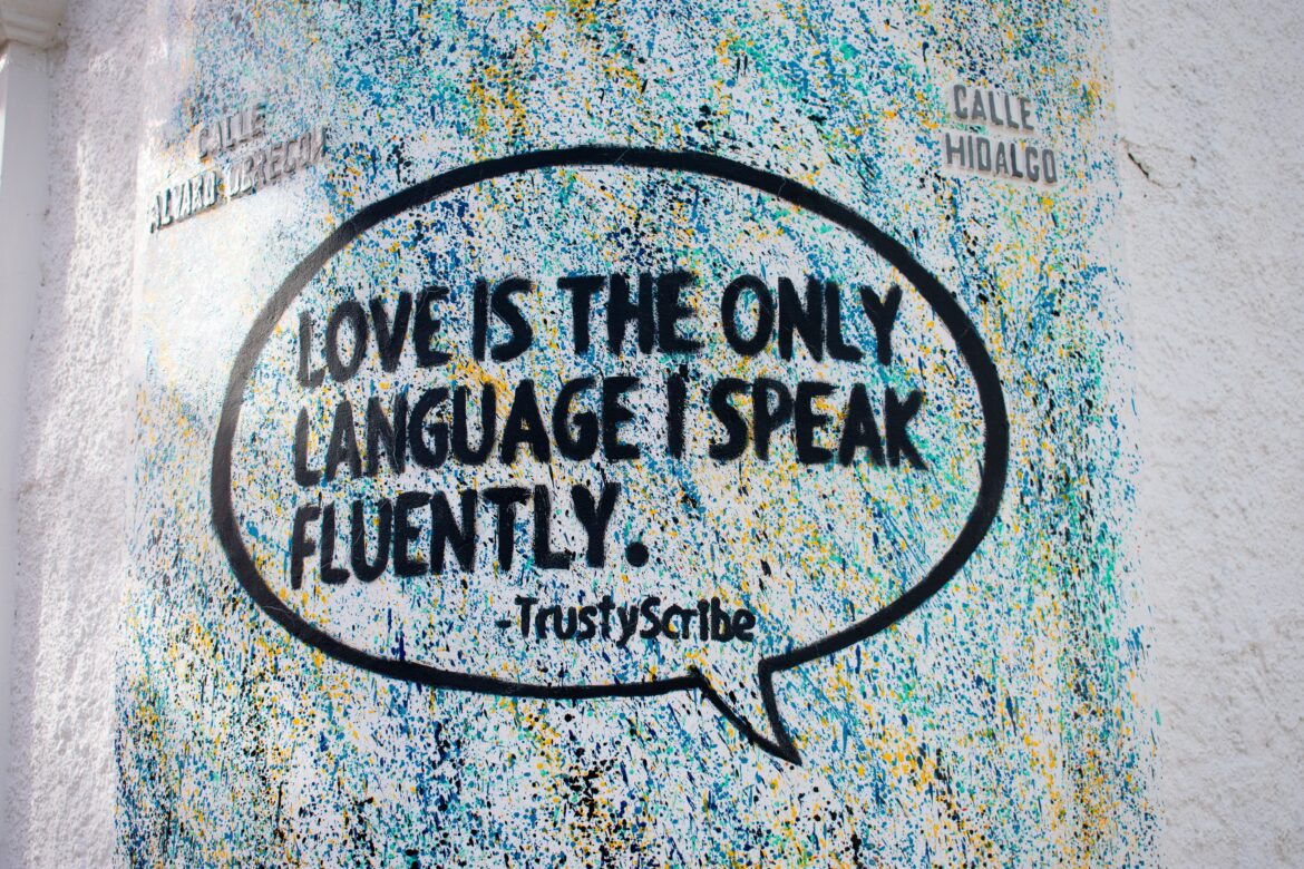 Photo of slogan "Love is the only language I speak fluently." Photo by Hannah Gibbs