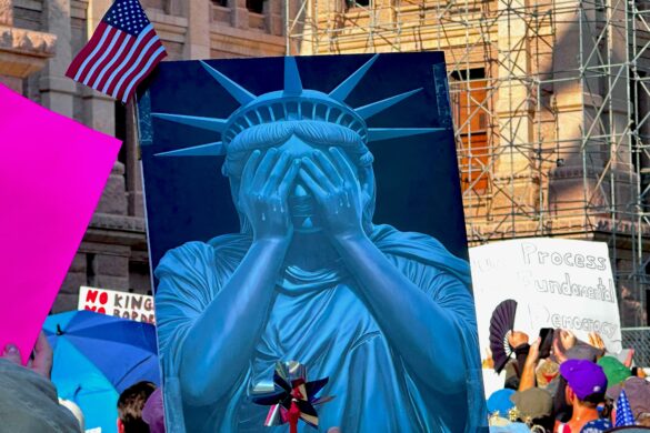Photo from Austin June 14 protest of a sign featuring the statue of liberty hiding her eyes.