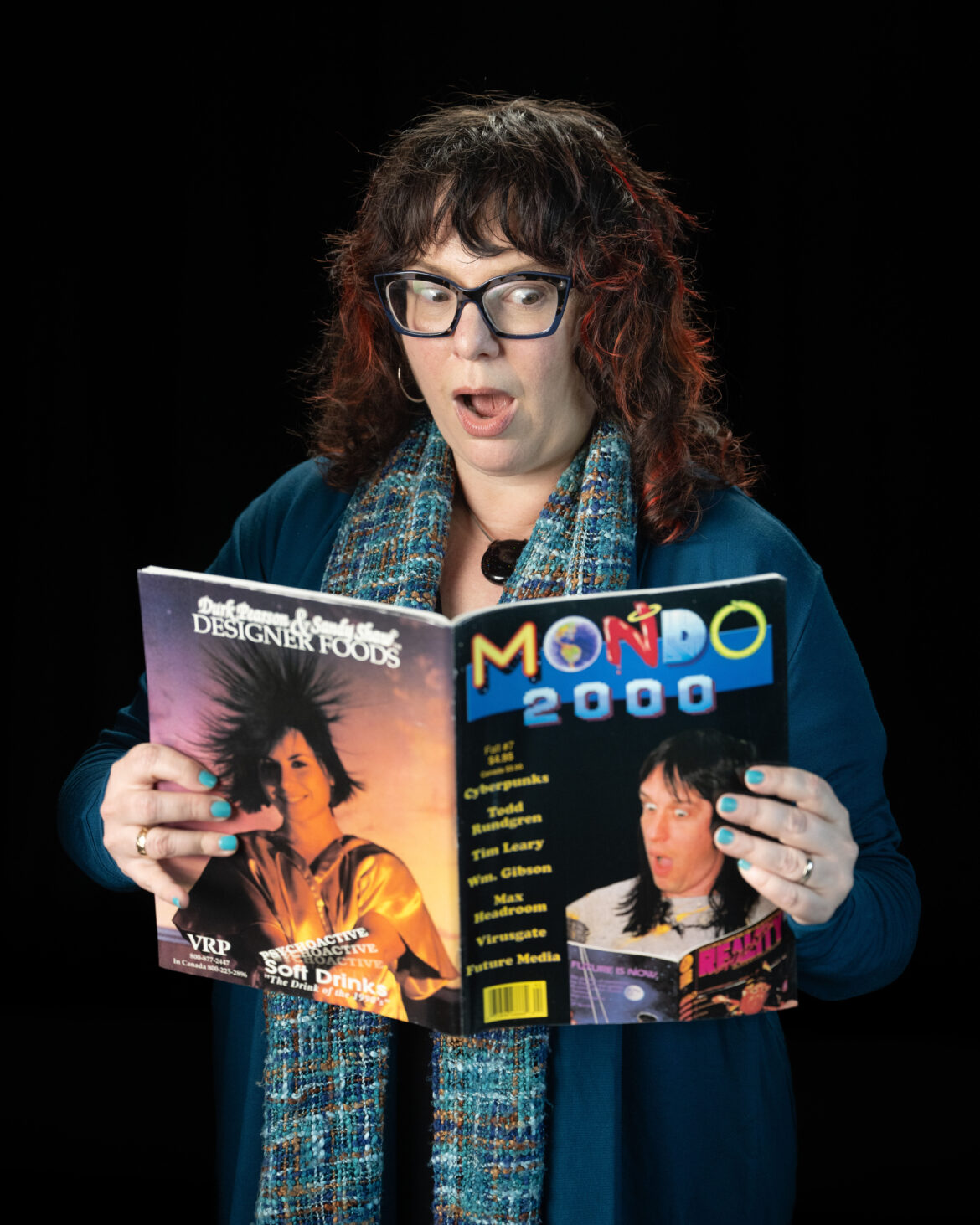Photo of Shira Chess with a copy of Mondo 2000.
